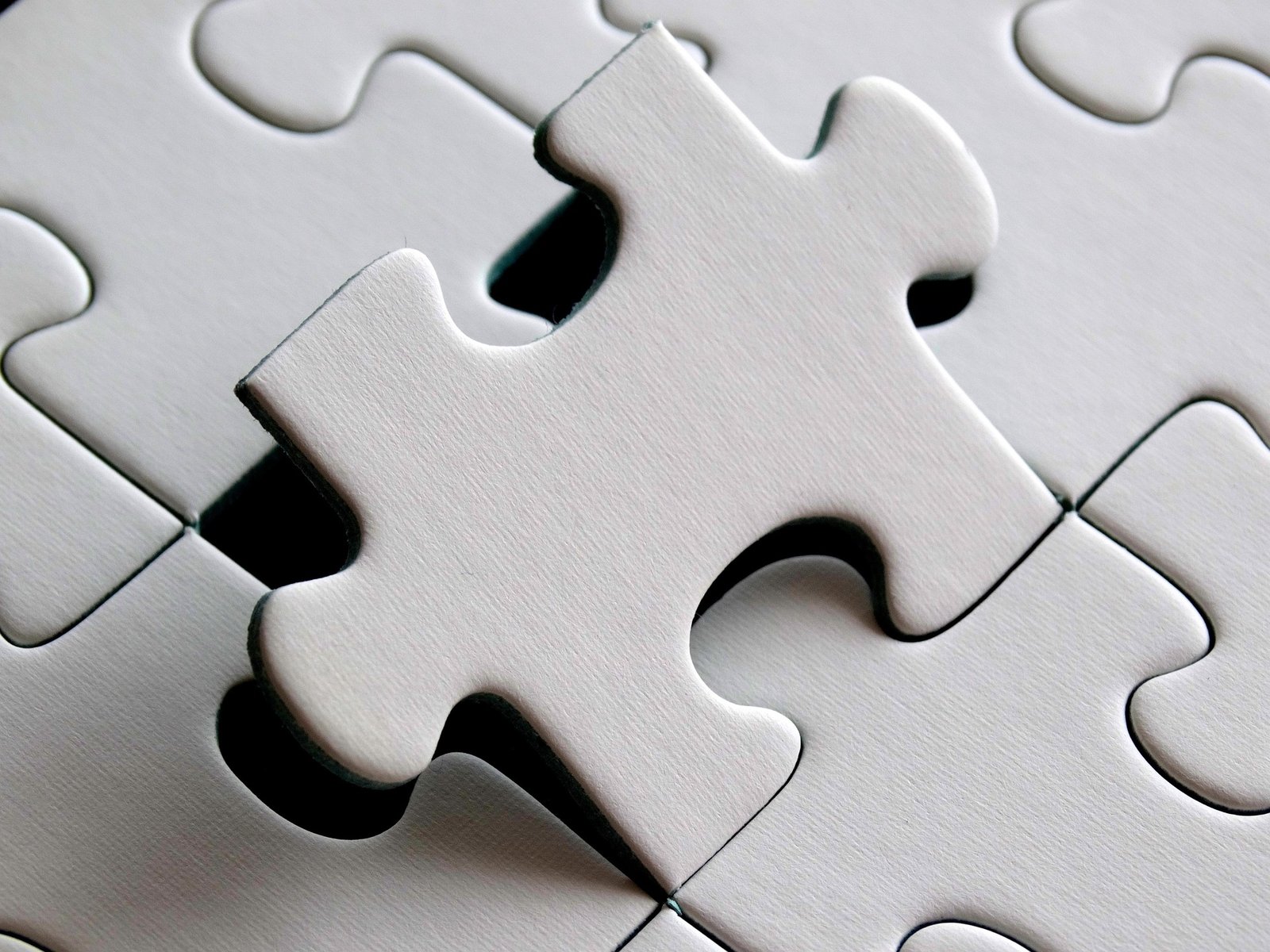 A puzzle piece being carefully fitted into place